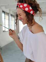Beautiful Laughing Woman Artist Portrait. Inspiration, Happiness, Creativity concept.