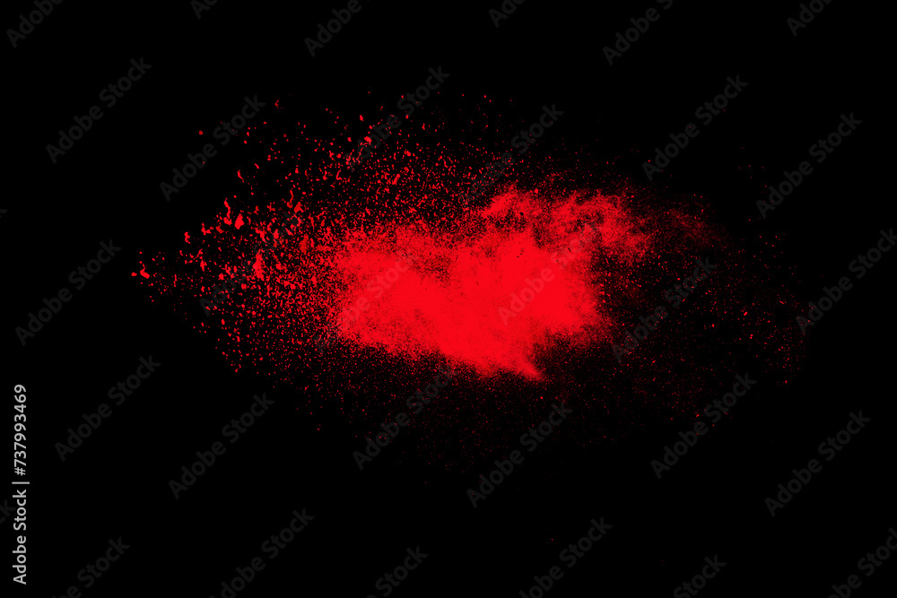 Wall mural abstract red powder dust particles explosion on black background. powders dust splash, paint holi, f