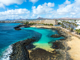 Discover El Jablillo idyllic waters, a snorkeler haven in Costa Teguise, Lanzarote, framed by...