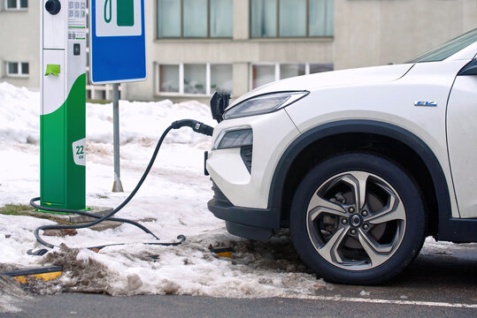 Minsk, Belarus. Jan 28, 2024. Electric car Honda M-NV Dongfeng, charge battery at paking lot in cold winter season