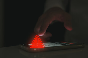 risk and notification error and maintenance concept, user using smartphone with triangle caution...