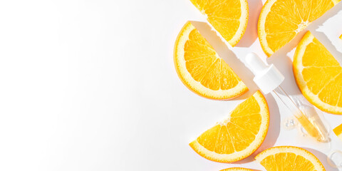 Cosmetic serum gel beauty drop and cosmetic pipette on white background with sliced oranges....