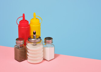 Delicious dinner with mustard, ketchup, salt, sugar and pepper. Copy space for text.