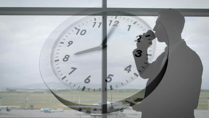 Animation of clock with fast moving hands over caucasian businessman using smartphone at airport
