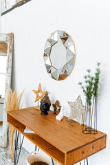 Rectangular hardwood table with mirror on wall, enhancing interior design