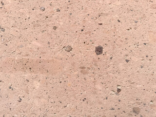 Speckled Pink Concrete Surface with Small Stones.