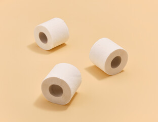 Three rolls of white soft toilet paper. Cleaning and hygiene.