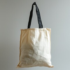 Textile shopping bag hanging from hook.