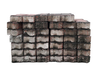 Pile of dirty pavement bricks, concrete blocks for paving. Pavement bricks are stacking for...