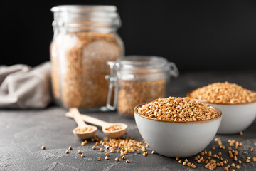 Green buckwheat in a bowl on a wooden kitchen table.Superfood.Raw buckwheat porridge.Healthy vegan food concept, eco products, diet. Copy space.Organic food.weight loss and proper nutrition.