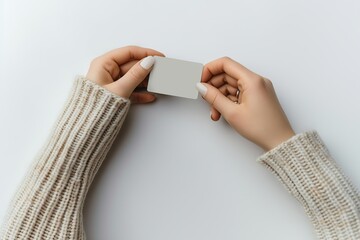 a woman's hand holding a debit card
