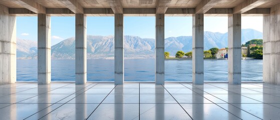 an empty room with columns and a view of mountains and a body of water with a house in the distance.