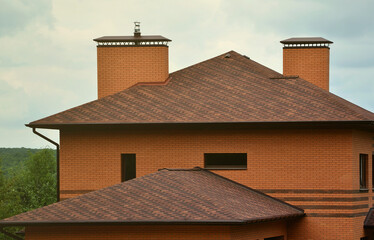 The house is equipped with high-quality roofing of shingles (bitumen tiles). A good example of perfect roofing. The roof is reliably protected from adverse weather conditions