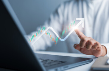 Businessman use computer laptop to analyze company profit growth, future business income increase graph, development to reach goals, business strategy, and financial data for long term investment.
