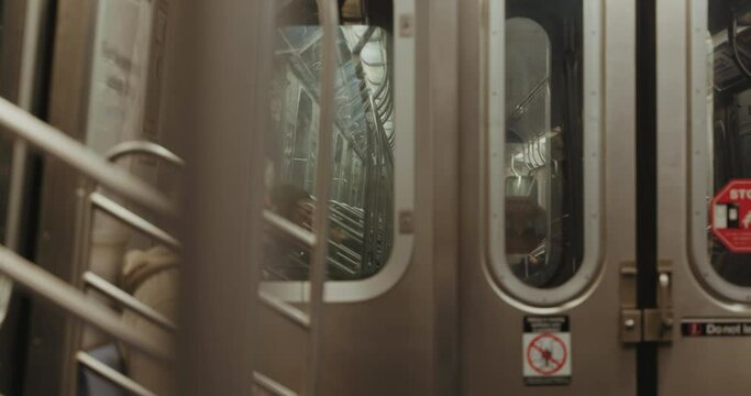 Aesthetic shot of moving subway carriage inside. New York City