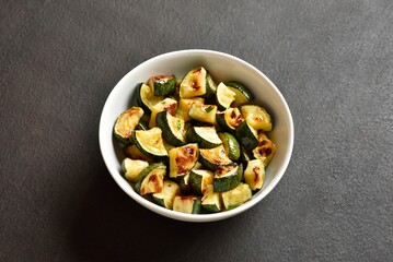 Oven roasted zucchini with garlic and greens
