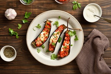 Roasted aubergine with yogurt and tomato sauce dressing