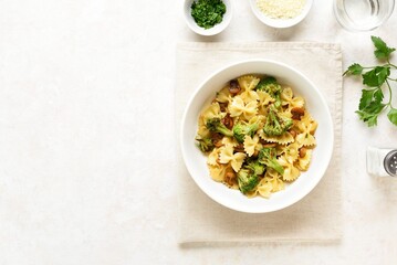 Farfalle pasta with roasted broccoli and mushrooms in bowl