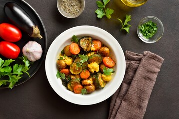 Stewed seasonal vegetables on plate, top view