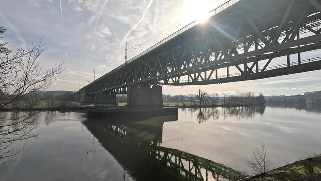 Danube river near Regensburg with railway bridge, sunny