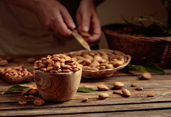 Almond nuts on a wooden table.