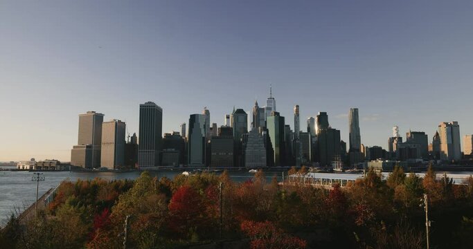 Static shot of iconic view of Manhattan from Brooklyn Bridge Park. Autumnal panorama of Manhattan.
