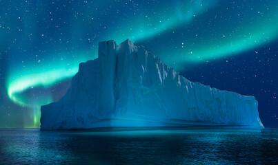 Iceberg floating in greenland fjord  
with aurora borealis - Greenland - obrazy, fototapety, plakaty