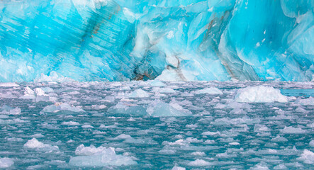 A close-up of the layered surface of a blue glacier - Knud Rasmussen Glacier near Kulusuk -...