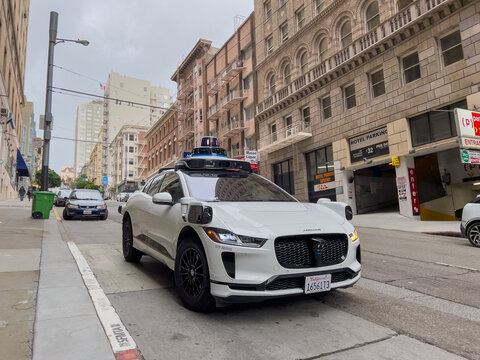San Francisco, California, USA - 1-6-24: Waymo self driving taxi driving in downtown San Francisco, California