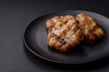 Round minced chicken or pork cutlet wrapped in bacon with salt, spices and herbs