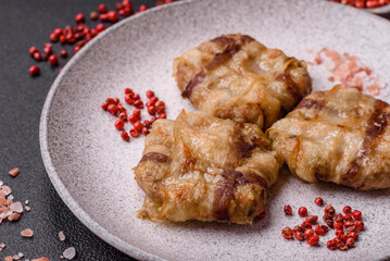 Round minced chicken or pork cutlet wrapped in bacon with salt, spices and herbs