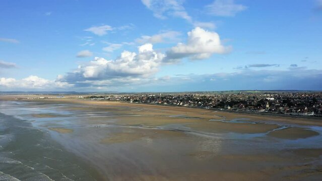 The beach by the Channel Sea at Sword beach in Europe, France, Normandy, towards Caen, Ouistreham, in spring, on a sunny day.