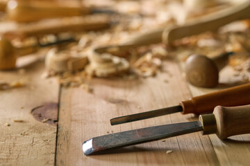Timber, wood processing. Joinery work. Wood carving with work tools close up. Hand of carver...