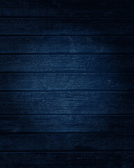 Dark blue wooden boards texture with a light effect.