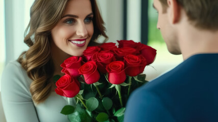 A man gives red roses to a beautiful woman.