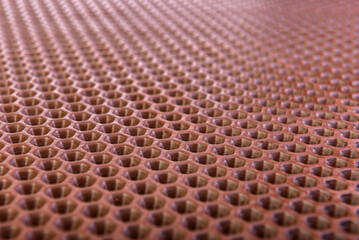 Brown rubber entrance mat texture or background.