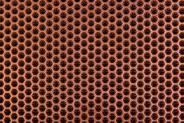 Brown rubber entrance mat texture or background.