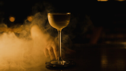 Elegant cocktail on bar with smoke
