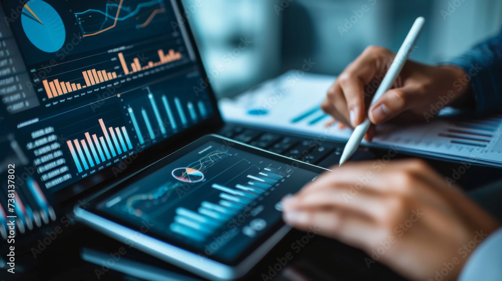 Poster an individual's hands using a stylus on a tablet with financial analysis graphs on the screen, place