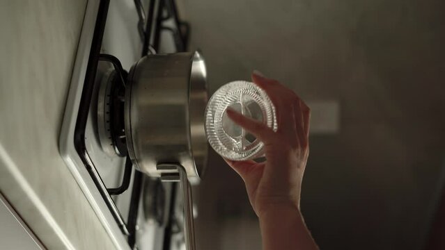 Pouring sugar and water into free saucepan for boiling. Dessert Cooking.
