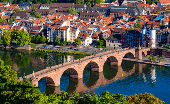 Panorama of the historic old town of Heidelberg am Neckar in Germany on a summer day. Old bridge “Karl Theodor Bridge“ and its twin tower gate, seen from the “Philosophenweg“ a popular view point.