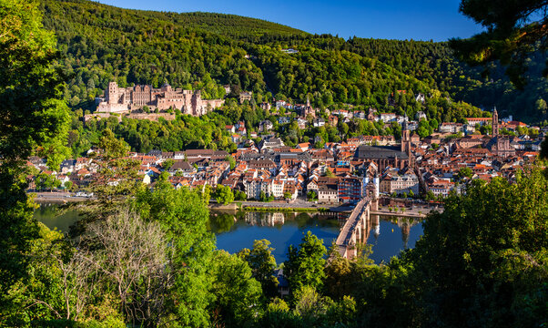 Panorama of the historic old town of Heidelberg am Neckar in Baden-W&uuml;rttemberg, Germany on a beautiful summer day. Castle, bridge, churches and other listed buildings seen from the Philosophenweg.