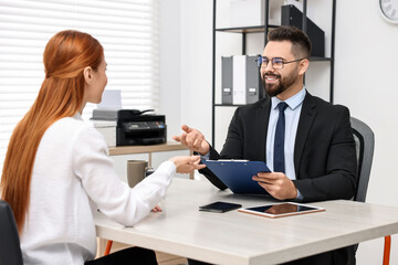 Immigration. Woman having interview with embassy worker in office