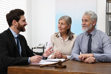 Senior couple having meeting with lawyer in office