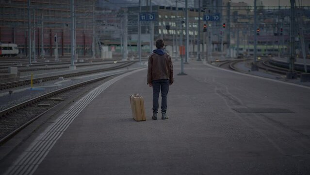 Mother Meeting Son at Train Station Talking Together after a long time 