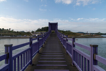 purple wooden bridge at the seaside