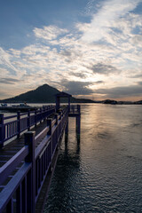 View of the bridge at the seaside during sunset