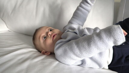 Toddler bay boy infant lying at home sofa
