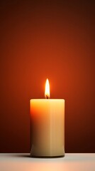 burning candle on black background