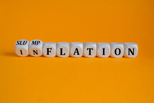 Inflation or slumpflation symbol. Concept words Inflation and Slumpflation on beautiful wooden cubes. Beautiful orange background. Business inflation slumpflation concept. Copy space. - Powered by Adobe